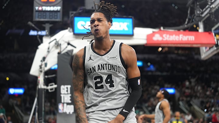 Apr 8, 2026; San Antonio, Texas, USA; San Antonio Spurs guard Devin Vassell (24) reacts after getting fouled while attempting to dunk during the first half against the Portland Trail Blazers at Frost Bank Center. Mandatory Credit: Scott Wachter-Imagn Images