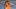 Ellie Thumann poses in a string bikini on the beach in Puerto Rico