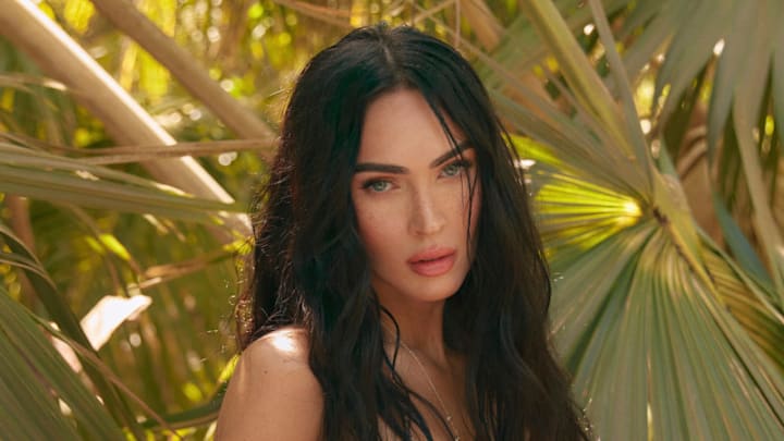 Megan Fox was photographed by Greg Swales in the Dominican Republic. Top: JÉBLANC. Skirt: JÉBLANC. Swim Bottom: Frankies Bikinis. Earrings: Jacquie Aiche. Ring: Jacquie Aiche.