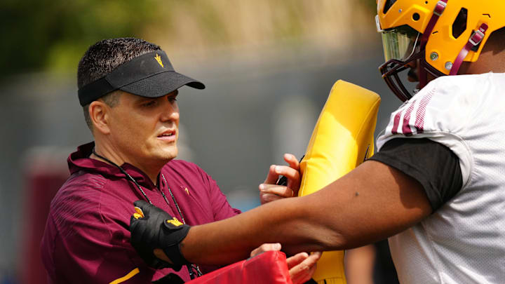 ASU defensive coordinator Brian Ward works with his team during a spring practice at the Kajikawa practice fields in Tempe on March 14, 2023.

Football Asu Spring
