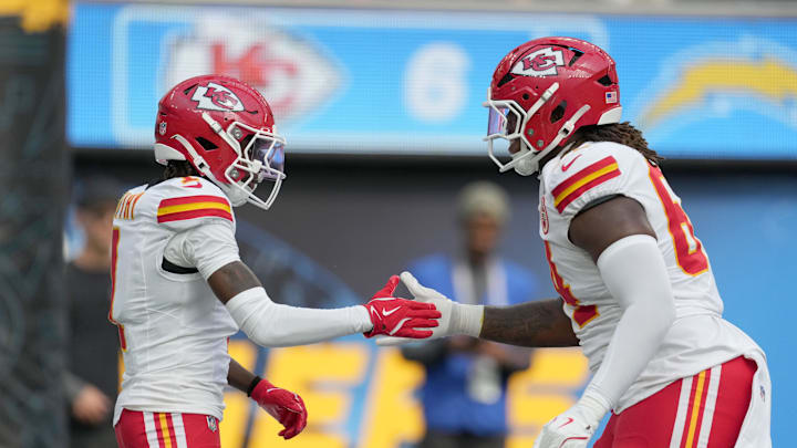 Sep 29, 2024; Inglewood, California, USA; Kansas City Chiefs wide receiver Xavier Worthy (1) celebrates with linebacker Leo Chenal (54) after catching a 54-yard touchdown pass in the second quarter against the Los Angeles Chargers at SoFi Stadium. Mandatory Credit: Kirby Lee-Imagn Images