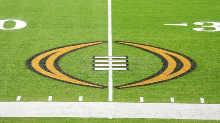 The College Football Playoff logo on the field at State Farm Stadium, the site of the 2022 CFP Semifinal between the TCU Horned Frogs and the Michigan Wolverines.