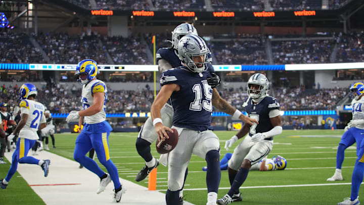 Aug 9, 2025; Inglewood, California, USA; Dallas Cowboys quarterback Will Grier (15) celebrates with tight end Rivaldo Fairweather (45) and wide receiver Traeshon Holden (7) after scoring on a 8-yard touchdown run against the Los Angeles Rams in the fourth quarter at SoFi Stadium. Mandatory Credit: Kirby Lee-Imagn Images