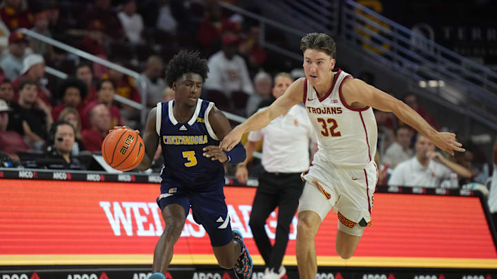 Nov 4, 2024; Los Angeles, California, USA; Chattanooga Mocs guard Honor Huff (3) dribbles the ball against Southern California Trojans guard Clark Slajchert (32) in the second half at Galen Center. Mandatory Credit: Kirby Lee-Imagn Images