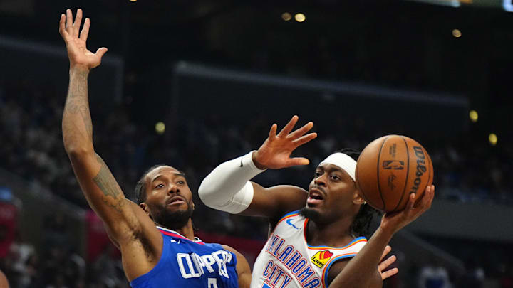 Jan 16, 2024; Los Angeles, California, USA; Oklahoma City Thunder guard Luguentz Dort (5) passes the