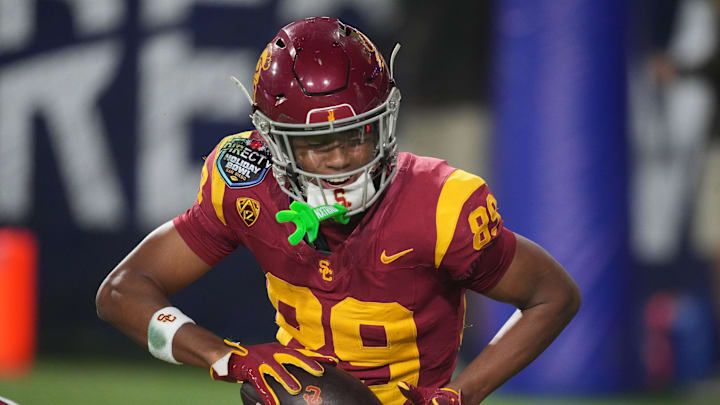 Dec 27, 2023; San Diego, CA, USA; Southern California Trojans wide receiver Ja'Kobi Lane (89) celebrates after a touchdown against the Louisville Cardinals in the Holiday Bowl at Petco Park. Mandatory Credit: Kirby Lee-Imagn Images