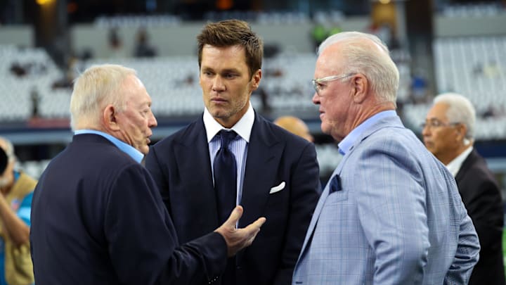 Sep 15, 2024; Arlington, Texas, USA;  Fox Sports commentator Tom Brady speaks with Dallas Cowboys owner Jerry Jones and CEO Stephen Jones before the game against the New Orleans Saints at AT&T Stadium. Mandatory Credit: Kevin Jairaj-Imagn Images