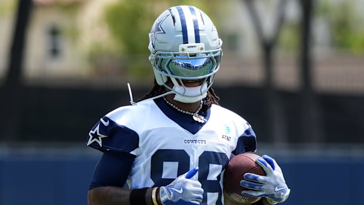 Jul 22, 2025; Oxnard, CA, USA; Dallas Cowboys receiver CeeDee Lamb (88) carries the ball during training camp at the River Ridge Fields. Mandatory Credit: Kirby Lee-Imagn Images