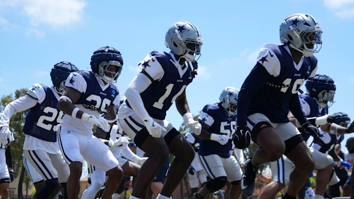 Jul 27, 2025; Oxnard, CA, USA; Dallas Cowboys defensive players run drills at training camp at the River Ridge Fields. Mandatory Credit: Kirby Lee-Imagn Images