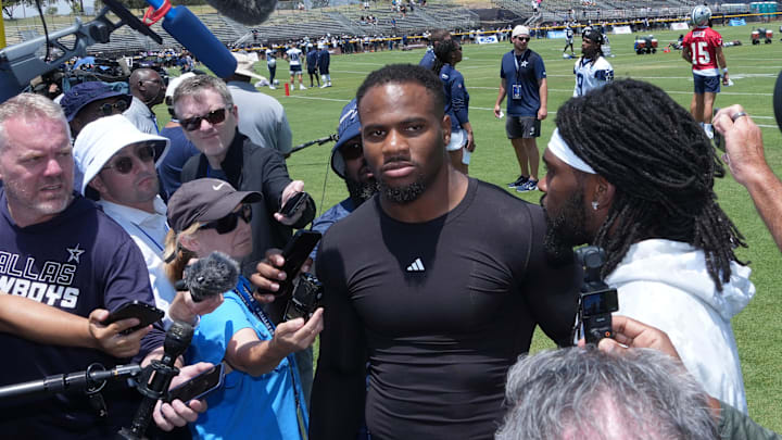 Jul 22, 2025; Oxnard, CA, USA; Dallas Cowboys defensive end Micah Parsons (left) and cornerback Trevon Diggs talks to media during training camp at the River Ridge Fields. Mandatory Credit: Kirby Lee-Imagn Images