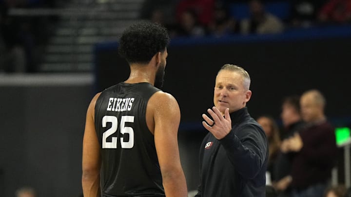 Dec 19, 2023; Los Angeles, California, USA; Cal State Northridge Matadors head coach Andy Newman (right) talks with forward De'Sean Allen-Eikens (25) against the UCLA Bruins in the second half at Pauley Pavilion presented by Wescom. CSUN defeated UCLA 76-72. Mandatory Credit: Kirby Lee-USA TODAY Sports