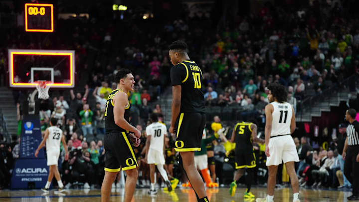 Mar 16, 2024; Las Vegas, NV, USA; Oregon Ducks forward Kwame Evans Jr. (10) and guard Jackson Shelstad (3) celebrate after the Pac-12 Championship game against the Colorado Buffaloes at T-Mobile Arena. Mandatory Credit: Kirby Lee-Imagn Images Mar 16, 2024; Las Vegas, NV, USA; Oregon Ducks forward Kwame Evans Jr. (10) and guard Jackson Shelstad (3) celebrate after the Pac-12 Championship game against the Colorado Buffaloes at T-Mobile Arena. Mandatory Credit: Kirby Lee-Imagn Images