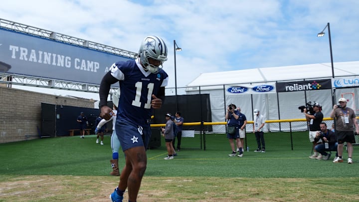 Jul 22, 2025; Oxnard, CA, USA; Dallas Cowboys defensive end Micah Parsons (11) enters the field during training camp at the River Ridge Fields. Mandatory Credit: Kirby Lee-Imagn Images