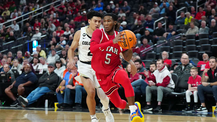 Mar 14, 2024; Las Vegas, NV, USA; Utah Utes guard Deivon Smith (5) drives to the basket against