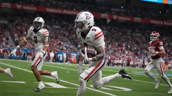 Dec 28, 2023; San Antonio, TX, USA; Arizona Wildcats safety Gunner Maldonado (9) carries the ball on a 87-yard fumble recovery for a touchdown against the Oklahoma Sooners in the second half of the Alamo Bowl at Alamodome. Mandatory Credit: Kirby Lee-USA TODAY Sports