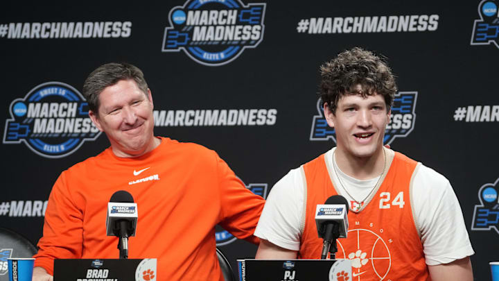 Mar 29, 2024; Los Angeles, CA, USA; Clemson Tigers coach Brad Brownell (left) and center PJ Hall