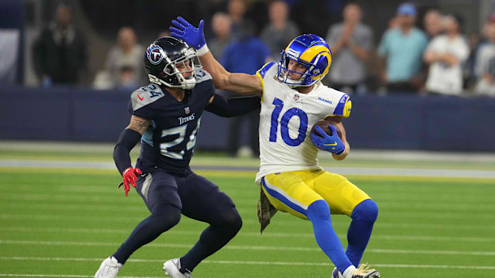Nov 7, 2021; Inglewood, California, USA; Los Angeles Rams wide receiver Cooper Kupp (10) is defended by Tennessee Titans cornerback Elijah Molden (24) in the second half at SoFi Stadium. Mandatory Credit: Kirby Lee-Imagn Images