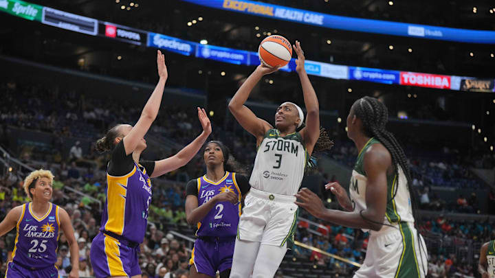 Jul 16, 2024; Los Angeles, California, USA; Seattle Storm forward Nneka Ogwumike (3) shoots the ball against LA Sparks forward Dearica Hamby (5) and LA Sparks forward Rickea Jackson (2) in the second half at Crypto.com Arena. Mandatory Credit: Kirby Lee-Imagn Images