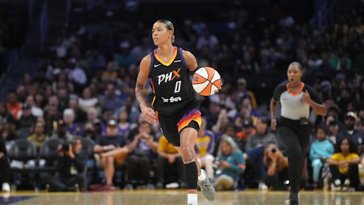 Sep 17, 2024; Los Angeles, California, USA; Phoenix Mercury guard Natasha Cloud (0) dribbles the ball against the LA Sparks in the first half at Crypto.com Arena. Mandatory Credit: Kirby Lee-Imagn Images