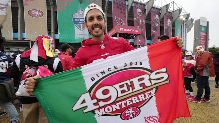 A San Francisco 49ers fan poses outside Estadio Azteca