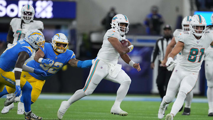 Dec 11, 2022; Inglewood, California, USA; Miami Dolphins quarterback Tua Tagovailoa (1) is pursued