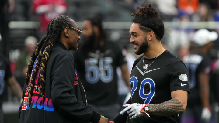 Feb 5, 2023; Paradise, Nevada, USA; AFC captain Snoop Dogg (left) shakes hands with NFC safety Talanoa Hufanga of the San Francisco 49ers (29) during the Pro Bowl Games at Allegiant Stadium. Mandatory Credit: Kirby Lee-USA TODAY Sports