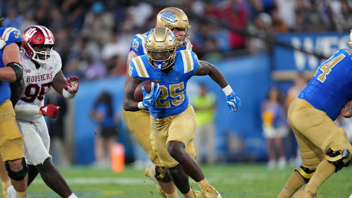 Sep 14, 2024; Pasadena, California, USA; UCLA Bruins running back T.J. Harden (25) carries the ball in the second half against the Indiana Hoosiers at Rose Bowl. Mandatory Credit: Kirby Lee-Imagn Images Sep 14, 2024; Pasadena, California, USA; UCLA Bruins running back T.J. Harden (25) carries the ball in the second half against the Indiana Hoosiers at Rose Bowl. Mandatory Credit: Kirby Lee-Imagn Images