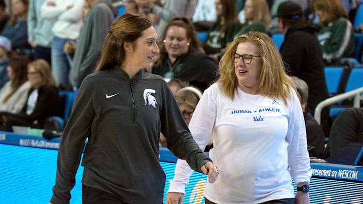 Feb 16, 2025; Los Angeles, California, USA; Michigan State Spartans head coach Robyn Fralick (left) talks with UCLA Bruins head coach Cori Close during the game at Pauley Pavilion presented by Wescom. Mandatory Credit: Kirby Lee-Imagn Images