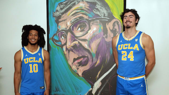 Oct 26, 2022; San Francisco, CA, USA; UCLA Bruins guard Tyger Campbell (10) and forward Jaime Jaquez Jr. (24) pose with image of John Wooden during Pac-12 Media Day at Pac-12 Network Studios. Mandatory Credit: Kirby Lee-Imagn Images Oct 26, 2022; San Francisco, CA, USA; UCLA Bruins guard Tyger Campbell (10) and forward Jaime Jaquez Jr. (24) pose with image of John Wooden during Pac-12 Media Day at Pac-12 Network Studios. Mandatory Credit: Kirby Lee-Imagn Images