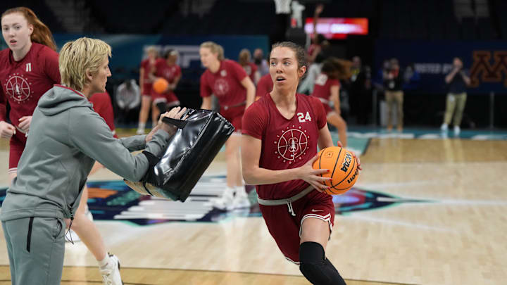 Mar 31, 2022; Minneapolis, MN, USA; Stanford Cardinal guard Lacie Hall (24) shoots the ball under supervison of assistant coach Kate Paye during NCAA women's Final Four practice at Target Center. Mandatory Credit: Kirby Lee-Imagn Images