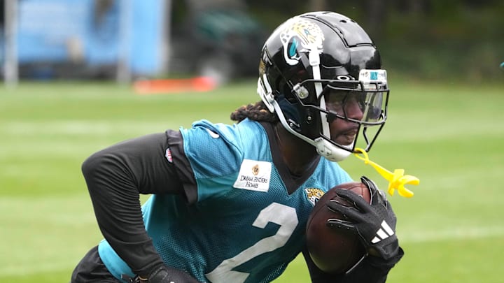 Oct 16, 2024; Watford, United Kingdom; Jacksonville Jaguars running back D'Ernest Johnson (2) carries the ball during practice at The Grove. Mandatory Credit: Kirby Lee-Imagn Images Oct 16, 2024; Watford, United Kingdom; Jacksonville Jaguars running back D'Ernest Johnson (2) carries the ball during practice at The Grove. Mandatory Credit: Kirby Lee-Imagn Images