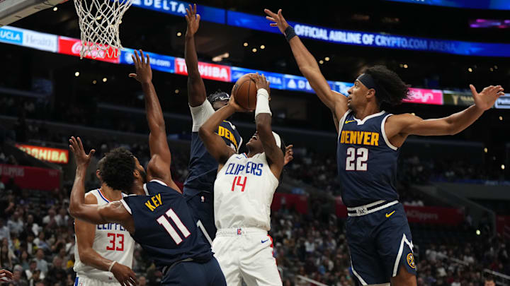 LA Clippers guard Terance Mann (14) shoots the ball against Denver Nuggets forward Braxton Key (11), guard Reggie Jackson (7) and forward Zeke Nnaji (22) in the first half at Crypto.com Arena. Mandatory Credit: Kirby Lee-Imagn Images LA Clippers guard Terance Mann (14) shoots the ball against Denver Nuggets forward Braxton Key (11), guard Reggie Jackson (7) and forward Zeke Nnaji (22) in the first half at Crypto.com Arena. Mandatory Credit: Kirby Lee-Imagn Images