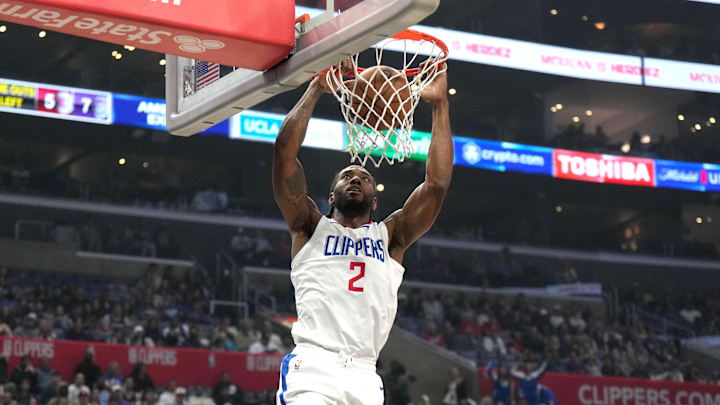 Feb 25, 2024; Los Angeles, California, USA; LA Clippers forward Kawhi Leonard (2) dunks the ball against the Sacramento Kings in the first half at Crypto.com Arena. 