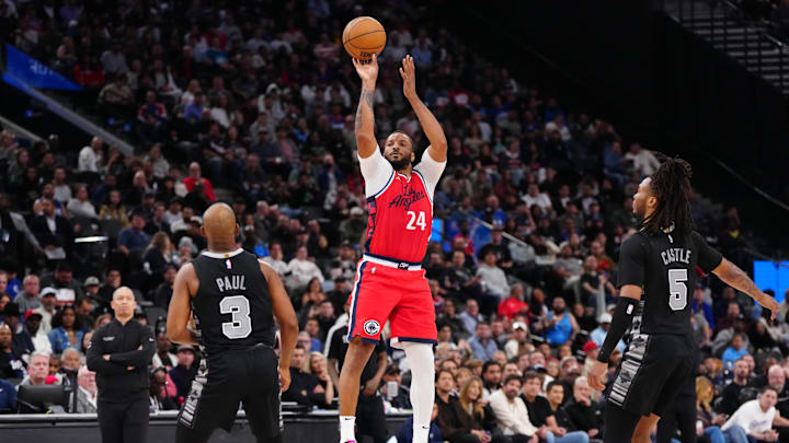 Apr 8, 2025; Inglewood, California, USA; LA Clippers guard Norman Powell (24) shoots the ball against San Antonio Spurs guard Stephon Castle (5) and guard Chris Paul (3) in the second half ata the Intuit Dome. Mandatory Credit: Kirby Lee-Imagn Images Apr 8, 2025; Inglewood, California, USA; LA Clippers guard Norman Powell (24) shoots the ball against San Antonio Spurs guard Stephon Castle (5) and guard Chris Paul (3) in the second half ata the Intuit Dome. Mandatory Credit: Kirby Lee-Imagn Images