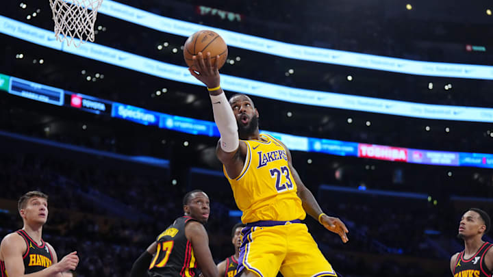 Mar 18, 2024; Los Angeles, California, USA; Los Angeles Lakers forward LeBron James (23) shoots the ball against Atlanta Hawks forward Onyeka Okongwu (17) in the second half at Crypto.com Arena. Mandatory Credit: Kirby Lee-Imagn Images