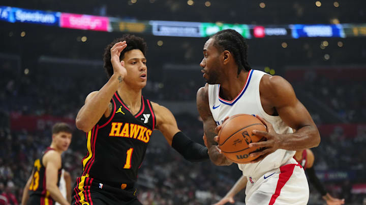 Mar 17, 2024; Los Angeles, California, USA; LA Clippers forward Kawhi Leonard (2) drives to the basket against Atlanta Hawks forward Jalen Johnson (1) in the first half at Crypto.com Arena. Mandatory Credit: Kirby Lee-Imagn Images