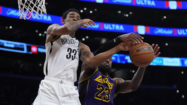 Jan 19, 2024; Los Angeles, California, USA; Brooklyn Nets center Nic Claxton (33) and Los Angeles Lakers forward LeBron James (23) battle for the ball in the second half at Crypto.com Arena. Mandatory Credit: Kirby Lee-Imagn Images Jan 19, 2024; Los Angeles, California, USA; Brooklyn Nets center Nic Claxton (33) and Los Angeles Lakers forward LeBron James (23) battle for the ball in the second half at Crypto.com Arena. Mandatory Credit: Kirby Lee-Imagn Images