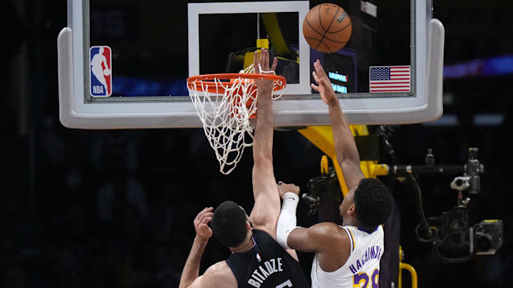 Mar 19, 2023; Los Angeles, California, USA; Orlando Magic center Goga Bitadze (35) goaltends a shot by Los Angeles Lakers forward Rui Hachimura (28) in the first half at Crypto.com Arena. Mandatory Credit: Kirby Lee-Imagn Images