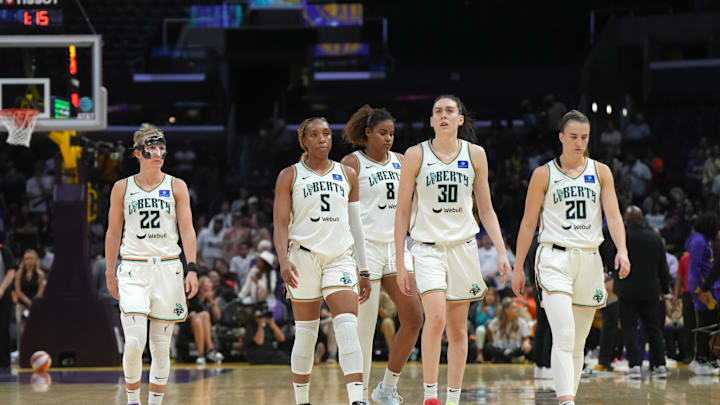 Aug 28, 2024; Los Angeles, California, USA; New York Liberty guard Courtney Vandersloot (22), forward Kayla Thornton (5), forward Nyara Sabally (8), forward Breanna Stewart (30) and guard Sabrina Ionescu (20) react against the LA Sparks in the second half at Crypto.com Arena. Mandatory Credit: Kirby Lee-Imagn Images