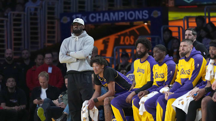 Mar 17, 2025; Los Angeles, California, USA; Los Angeles Lakers forward LeBron James watches from the bench against the San Antonio Spurs in the first half at Crypto.com Arena. Mandatory Credit: Kirby Lee-Imagn Images Mar 17, 2025; Los Angeles, California, USA; Los Angeles Lakers forward LeBron James watches from the bench against the San Antonio Spurs in the first half at Crypto.com Arena. Mandatory Credit: Kirby Lee-Imagn Images