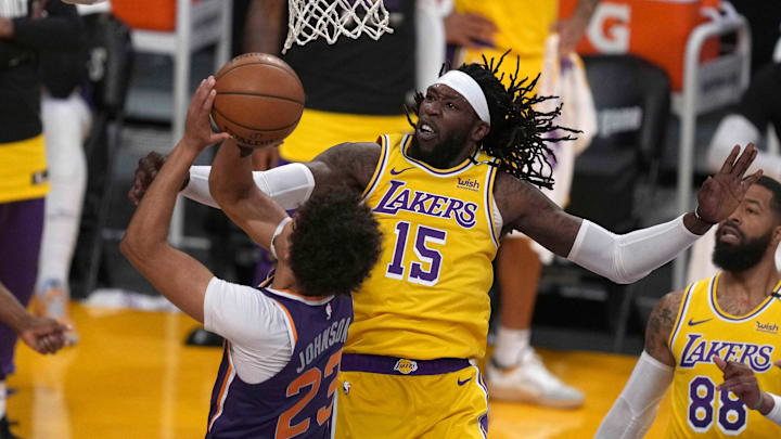 Jun 3, 2021; Los Angeles, California, USA; Phoenix Suns forward Cameron Johnson (23) is defended by Los Angeles Lakers center Montrezl Harrell (15) in the second quarter during game six in the first round of the 2021 NBA Playoffs at Staples Center. Mandatory Credit: Kirby Lee-Imagn Images
