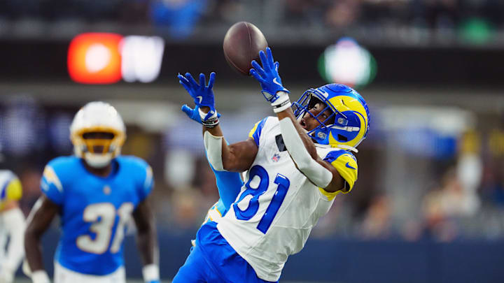 Aug 16, 2025; Inglewood, California, USA; iLos Angeles Rams wide receiver Brennan Presley (81) attempts to catch the ball against Los Angeles Chargers cornerback Nikko Reed (46) in the second half at SoFi Stadium. Mandatory Credit: Kirby Lee-Imagn Images