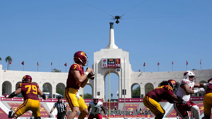 Sep 28, 2024; Los Angeles, California, USA; A general overall view as Southern California Trojans quarterback Miller Moss (7) throws the ball against the Wisconsin Badgers in the first half at United Airlines Field at Los Angeles Memorial Coliseum. Mandatory Credit: Kirby Lee-Imagn Images