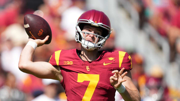 Sep 28, 2024; Los Angeles, California, USA; Southern California Trojans quarterback Miller Moss (7) throws the ball against the Wisconsin Badgers in the first half at United Airlines Field at Los Angeles Memorial Coliseum. Mandatory Credit: Kirby Lee-Imagn Images Sep 28, 2024; Los Angeles, California, USA; Southern California Trojans quarterback Miller Moss (7) throws the ball against the Wisconsin Badgers in the first half at United Airlines Field at Los Angeles Memorial Coliseum. Mandatory Credit: Kirby Lee-Imagn Images