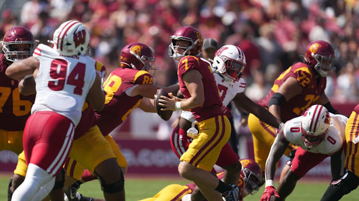 Sep 28, 2024; Los Angeles, California, USA; Southern California Trojans quarterback Miller Moss (7) throws the ball against the Wisconsin Badgers in the first half at United Airlines Field at Los Angeles Memorial Coliseum. Mandatory Credit: Kirby Lee-Imagn Images