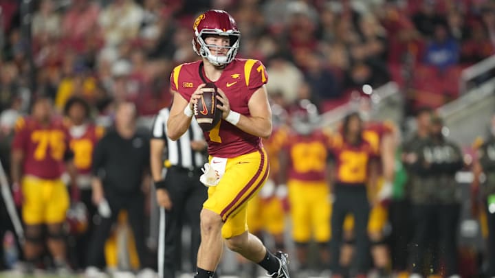Oct 25, 2024; Los Angeles, California, USA; Southern California Trojans quarterback Miller Moss (7) throws the ball against the Rutgers Scarlet Knights in the first half at United Airlines Field at Los Angeles Memorial Coliseum. Mandatory Credit: Kirby Lee-Imagn Images