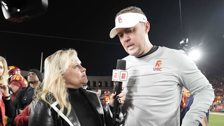 Nov 26, 2022; Los Angeles, California, USA; ESPN sideline reporter Holly Rowe (left) interviews Southern California Trojans head coach Lincoln Riley after the game at United Airlines Field against the Notre Dame Fighting Irish at Los Angeles Memorial Coliseum. Mandatory Credit: Kirby Lee-Imagn Images Nov 26, 2022; Los Angeles, California, USA; ESPN sideline reporter Holly Rowe (left) interviews Southern California Trojans head coach Lincoln Riley after the game at United Airlines Field against the Notre Dame Fighting Irish at Los Angeles Memorial Coliseum. Mandatory Credit: Kirby Lee-Imagn Images