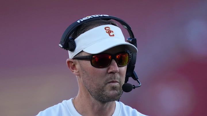 Oct 21, 2023; Los Angeles, California, USA; Southern California Trojans head coach Lincoln Riley watches from the sidelines against the Utah Utes in the first half at United Airlines Field at Los Angeles Memorial Coliseum. Mandatory Credit: Kirby Lee-Imagn Images