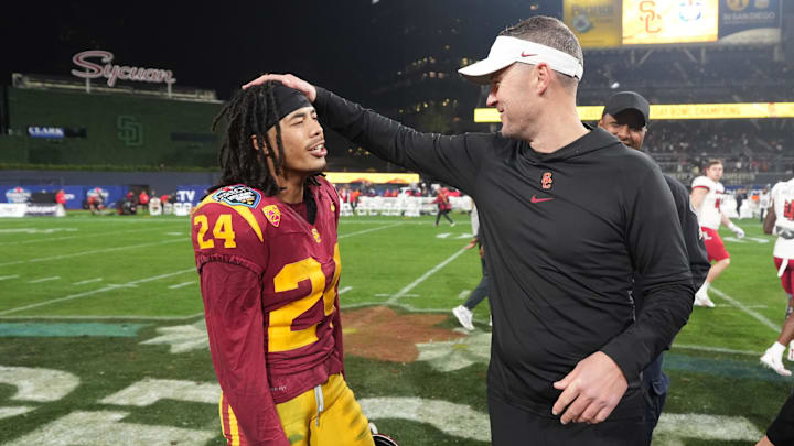 Dec 27, 2023; San Diego, CA, USA; Southern California Trojans head coach Lincoln Riley (right) celebrates with wide receiver Makai Lemon (24) after the Holiday Bowl against the Louisville Cardinals at Petco Park. Mandatory Credit: Kirby Lee-Imagn Images