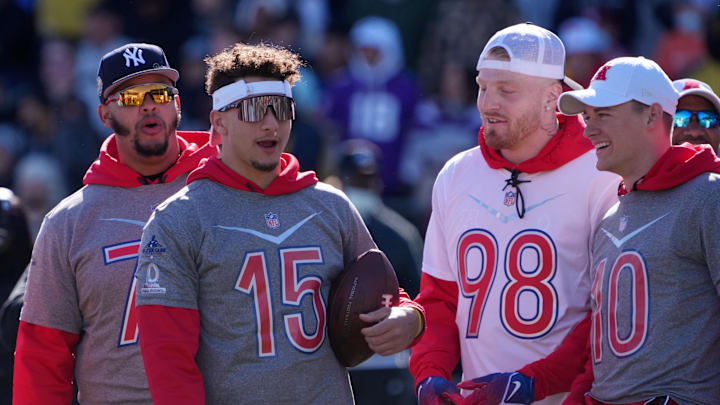 Feb 5, 2022; Las Vegas, NV, USA; Kansas City Chiefs quarterback Patrick Mahomes (15) and Las Vegas Raiders defensive end Maxx Crosby (98) and New England Patriots quarterback Mac Jones (10) react during AFC practice at the Las Vegas Ballpark. Mandatory Credit: Kirby Lee-Imagn Images
